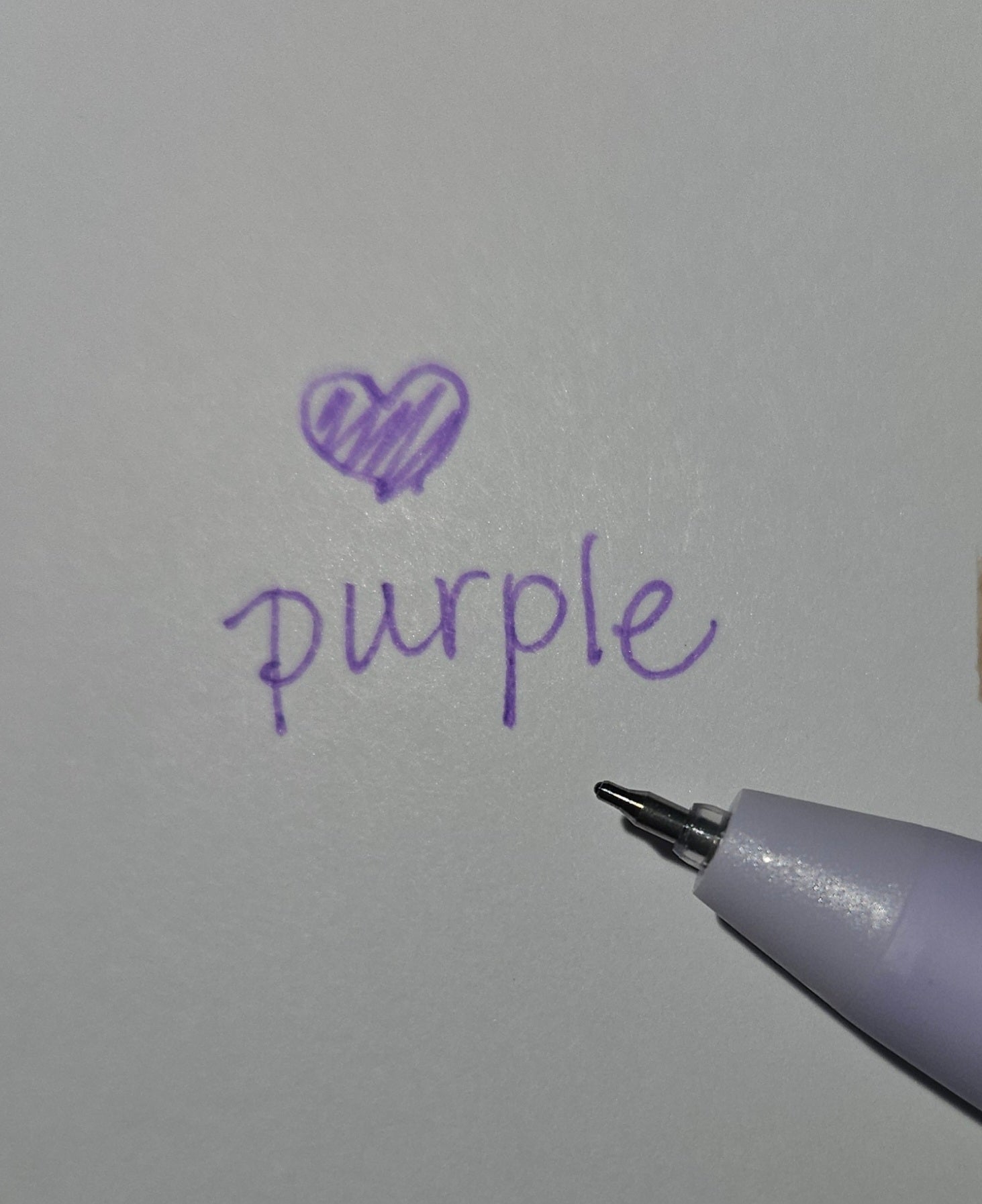 detail of tip of purple pen with color